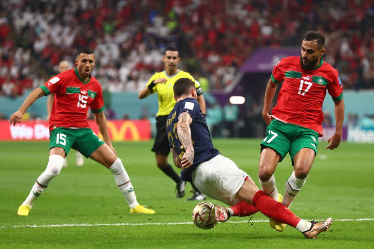 AL KHOR, QATAR - DECEMBER 14:   Theo Hernandez of France competes with Sofiane Boufal of Morocco during the FIFA World Cup Qatar 2022 semi final match between France and Morocco at Al Bayt Stadium on December 14, 2022 in Al Khor, Qatar. (Photo by Chris Brunskill/Fantasista/Getty Images)