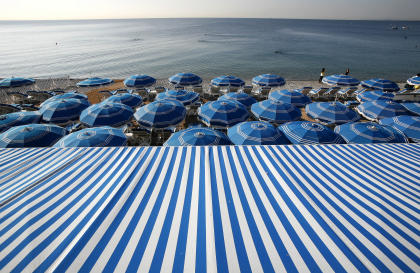 Blue and white beach umbrellas