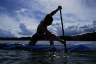Canoe sprint world champion Nevin Harrison, 19, of Seattle, trains near Lake Lanier Olympic Park on Thursday, July 1, 2021, in Gainesville, Ga. Harrison won the world championship in the women's sprint canoe 200 meters as a 17-year-old in 2019. Now she'll try to duplicate that at the Olympics in Tokyo where the race will be a new event in a bid for gender equity. (AP Photo/Brynn Anderson)