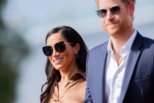 <p>Rolf Vennenbernd/picture alliance via Getty Images</p> Meghan Markle and Prince Harry at the Invictus Games on Sept. 14, 2023