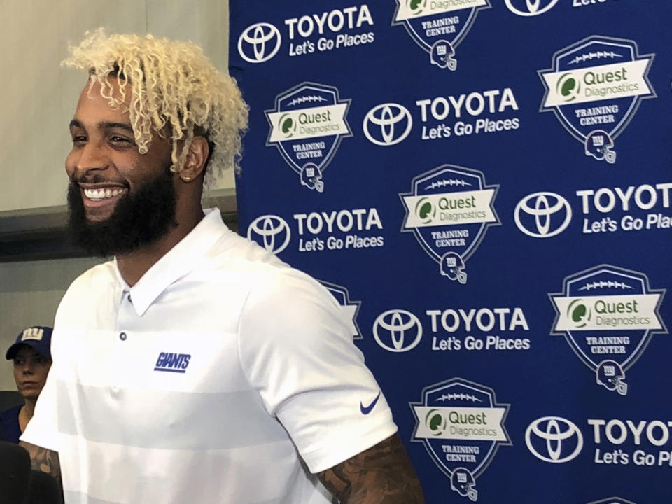 New York Giants' Odell Beckham Jr. speaks to the media in East Rutherford, N.J., Tuesday, Aug. 28, 2018. Beckham Jr. is now the NFL's highest-paid wide receiver. The Giants on Monday announced they have signed Beckham to a five-year contract extension that will keep the three-time Pro Bowler with the franchise for another six seasons. (AP Photo/Tom Canavan)