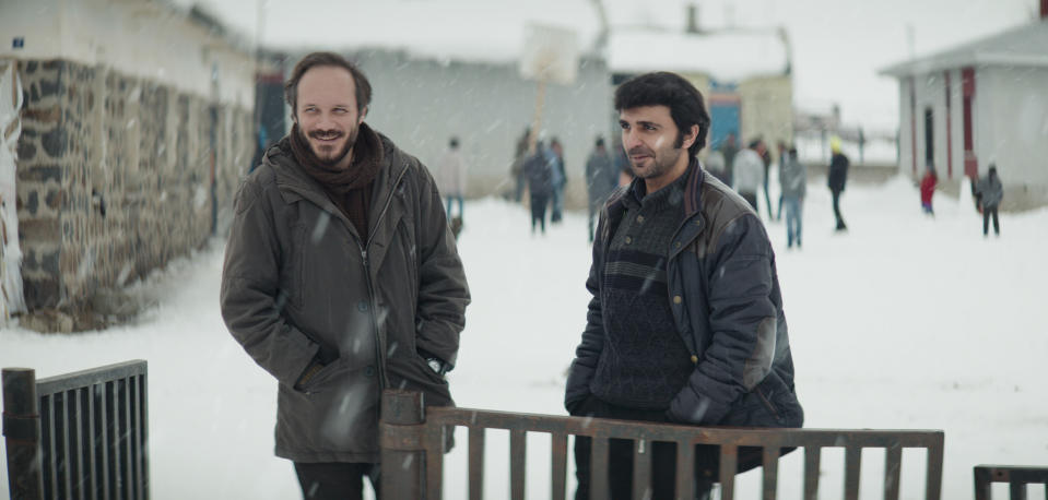 This image released by Janus and Sideshow Films shows Deniz Celiloğlu, left, and Musab Ekici in a scene from "About Dry Grasses." (Sideshow and Janus Films via AP)