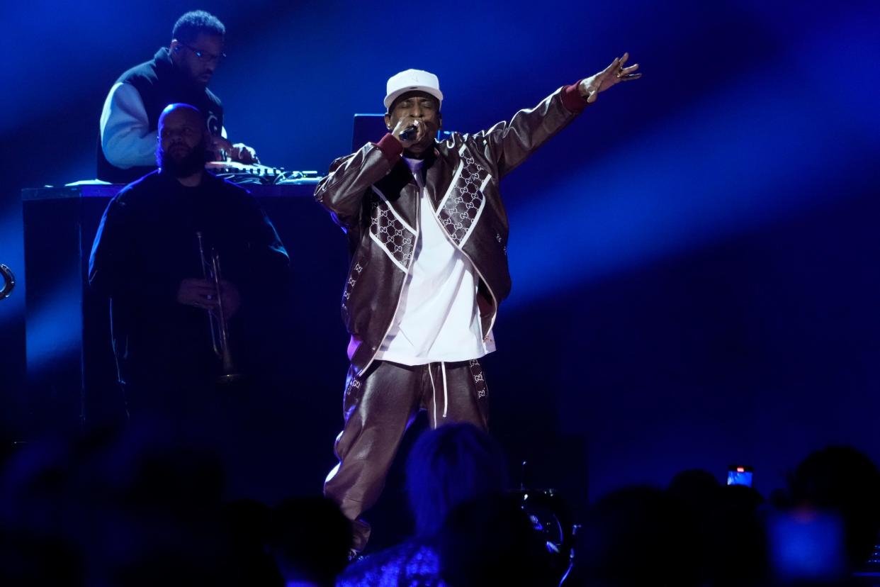 Rakim performs in a Gucci jacket for the 50 years of Hip Hop performance at the 2023 Grammys. Dapper Dan recalls cutomizing looks for the rapper to represent his personality in his Harlem boutique.