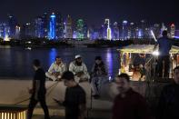 People gather at the Corniche in Doha, Qatar, Wednesday, Nov. 23, 2022. (AP Photo/Jorge Saenz)