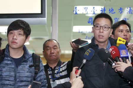 Student leaders of Taiwan's "Sunflower Movement" Lin Fei-fan (R) and Chen Wei-ting talk to reporters at the Taipei District court in this March 25, 2015 file photo. REUTERS/Pichi Chuang/Files