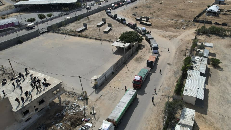 A convoy of lorries carrying humanitarian aid, including water, enters the Gaza Strip from Egypt via the Rafah border crossing on October 21, 2023. - Mohammed Abed/AFP/Getty Images