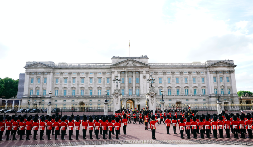 The Queen's coffin, draped in the Royal Standard with the Imperial State Crown placed on top, is carried from Buckingham Palace. (PA)