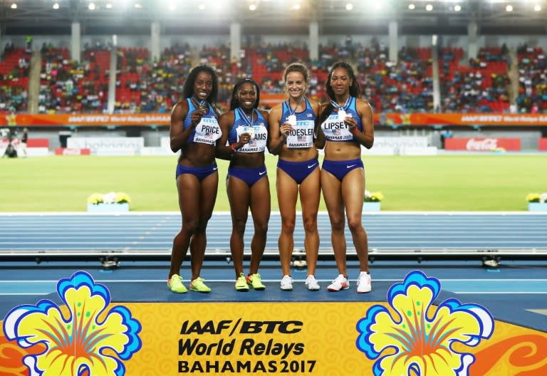 Chanelle Price, Chrishuna Williams, Laura Roesler and Charlene Lipsey of team USA pose on the podium after placing first in the 4x800m relay during the IAAF/BTC World Relays Bahamas 2017, at Thomas Robinson Stadium in Nassau, on April 22