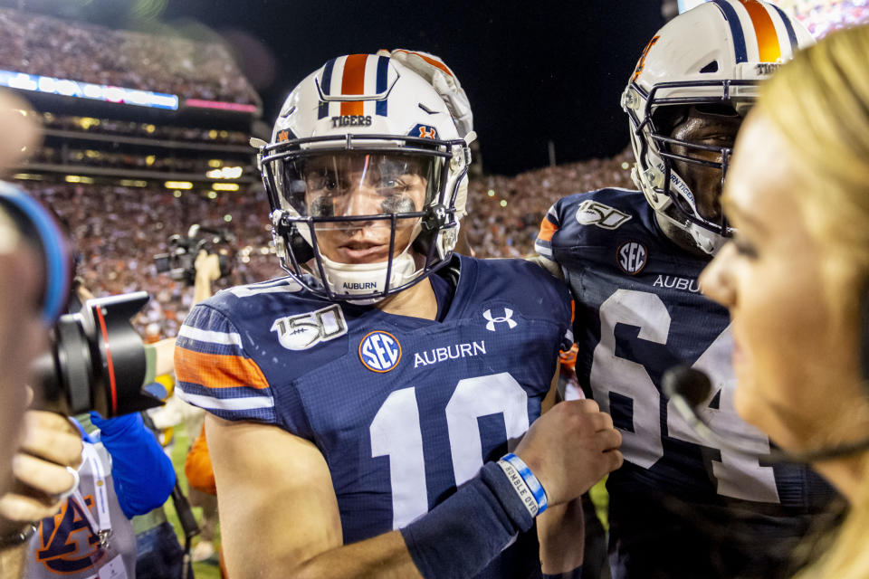 Auburn quarterback Bo Nix (10) celebrates after a win over Alabama in an NCAA college football game, Saturday, Nov. 30, 2019, in Auburn, Ala. (AP Photo/Vasha Hunt)