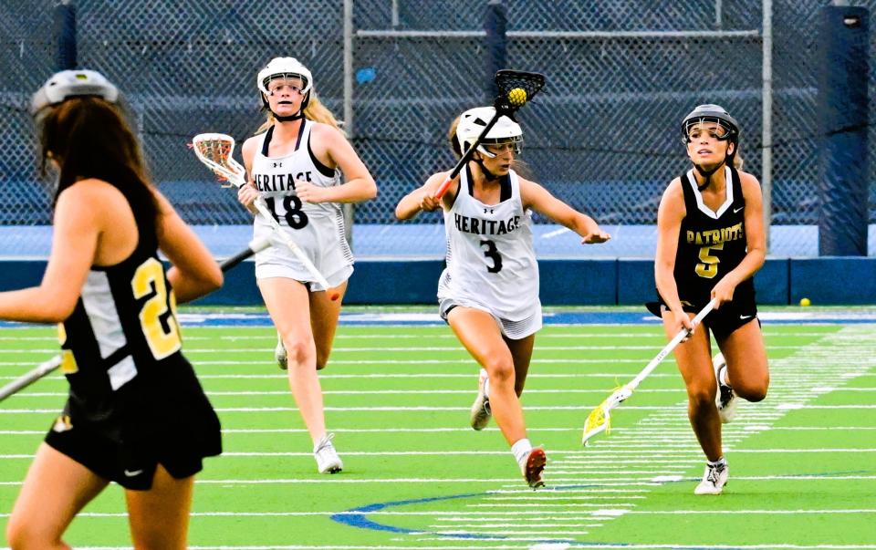 American Heritage-Delray's Jamie Woelfel brings the ball downfield in a regional semi-final win against American Heritage-Plantation on April 30, 2024.