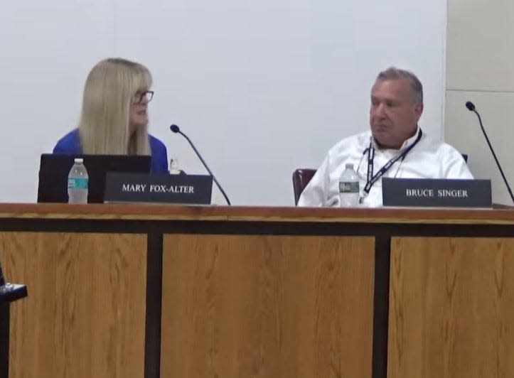 Mary Fox-Alter, left, speaks during a June 20, 2023 East Ramapo school board meeting during her final meeting as the district's state-appointed education monitor. Right, Bruce Singer, the district's fiscal monitor.