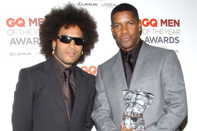 <p>Lawrence Lucier/Getty</p> Lenny Kravitz and Denzel Washington in 2002