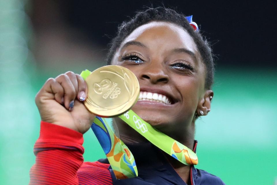 The USA’s Simone Biles celebrates victory in the Women’s Team Gymnastics final at the Rio Olympic Arena on the fourth day of the Rio Olympics Games (Owen Humphreys/PA) (PA Wire)