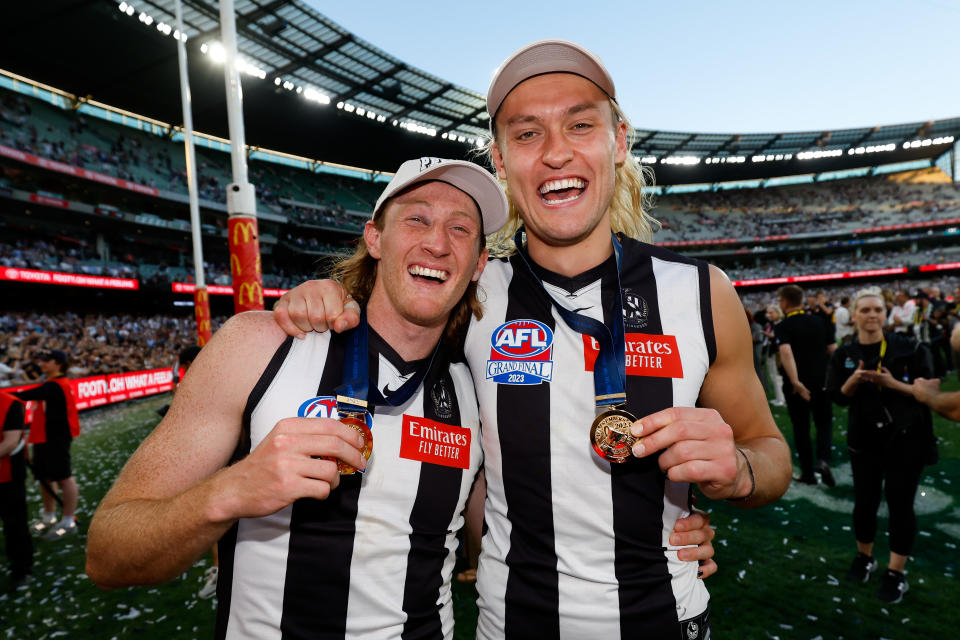 Nathan Murphy and Collingwood captain Darcy Moore.