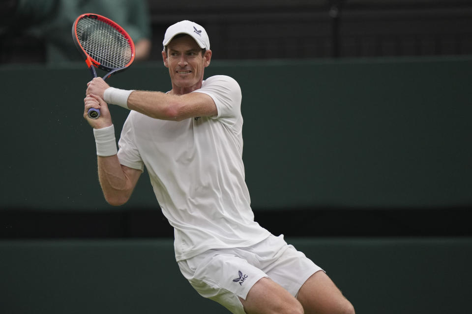 Britain's Andy Murray plays a return to Britain's Ryan Peniston during the first round men's singles match on day two of the Wimbledon tennis championships in London, Tuesday, July 4, 2023. (AP Photo/Alberto Pezzali)