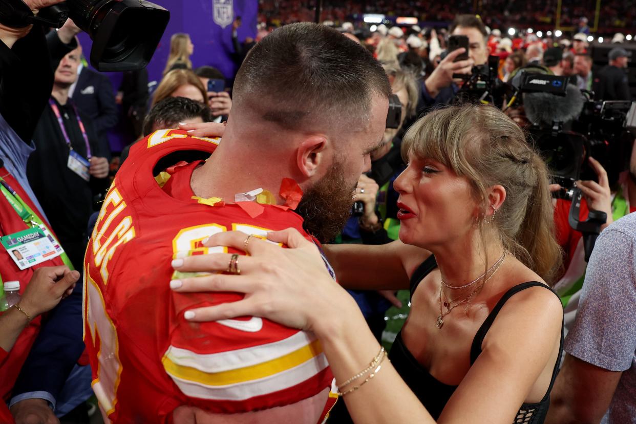 Tight end Travis Kelce and singer/songwriter Taylor Swift kiss after the Kansas City Chiefs beat the San Francisco 49ers in Super Bowl 58.