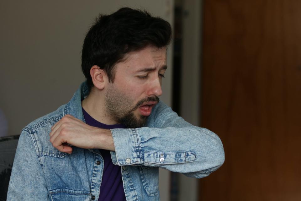 Man coughing_By Jojo Photos:Shutterstock