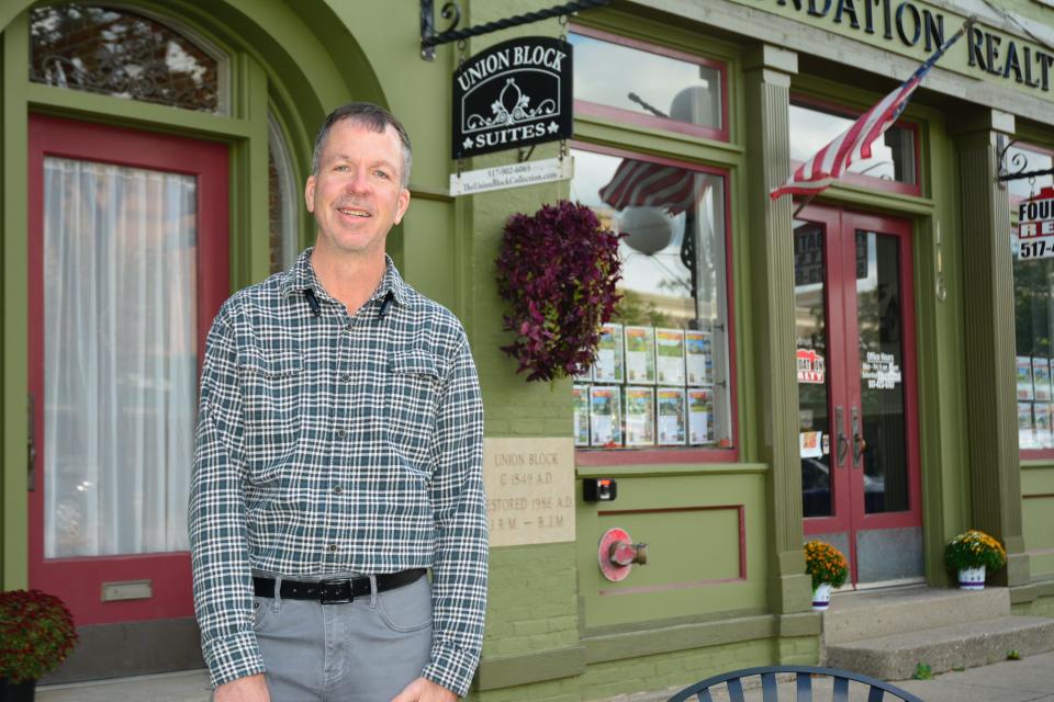 Entrepreneur Dan Meikle stands in front of the Union Block building in downtown Tecumseh. The building is one of the downtown buildings that Meikle has renovated in the past several years. Meikle is the 2023 Musgrove Evans Award recipient.