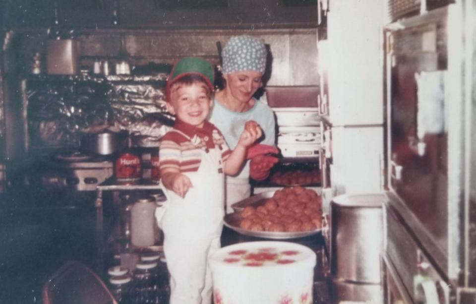 Wade Tatangelo rolling meatballs with his grandma, Mary Tatangelo, at Lucy's Cafe in Hershey, Pennsylvania, during the early 1980s.