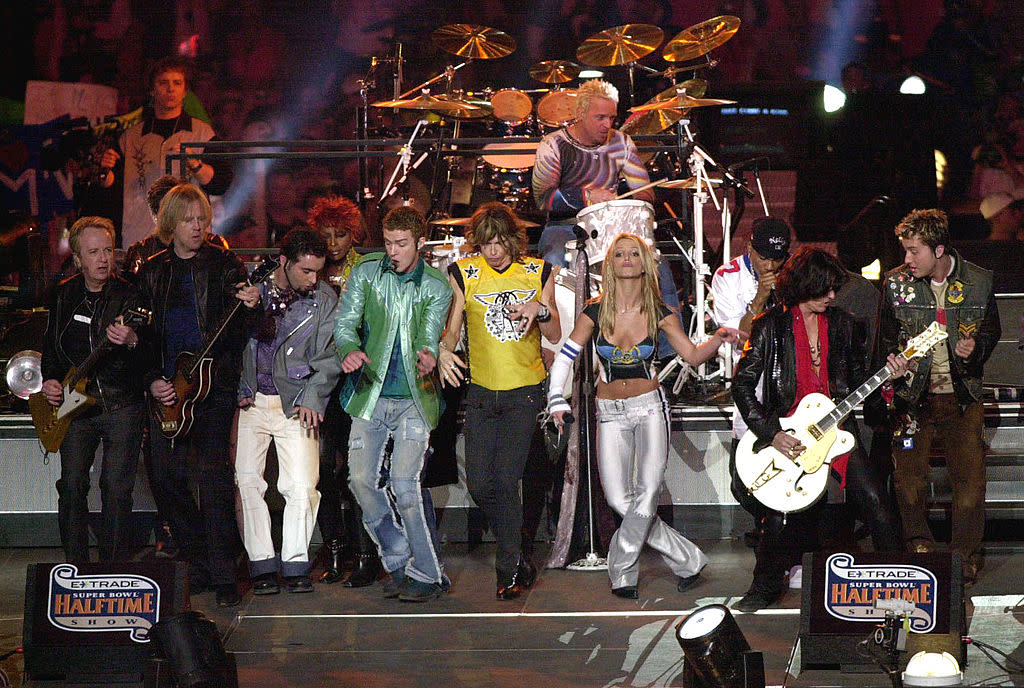 Britney Spears, fourth from right, and Lance Bass, right, perform during the halftime show at the 2001 Super Bowl. (Photo: Doug Pensinger/ALLSPORT)