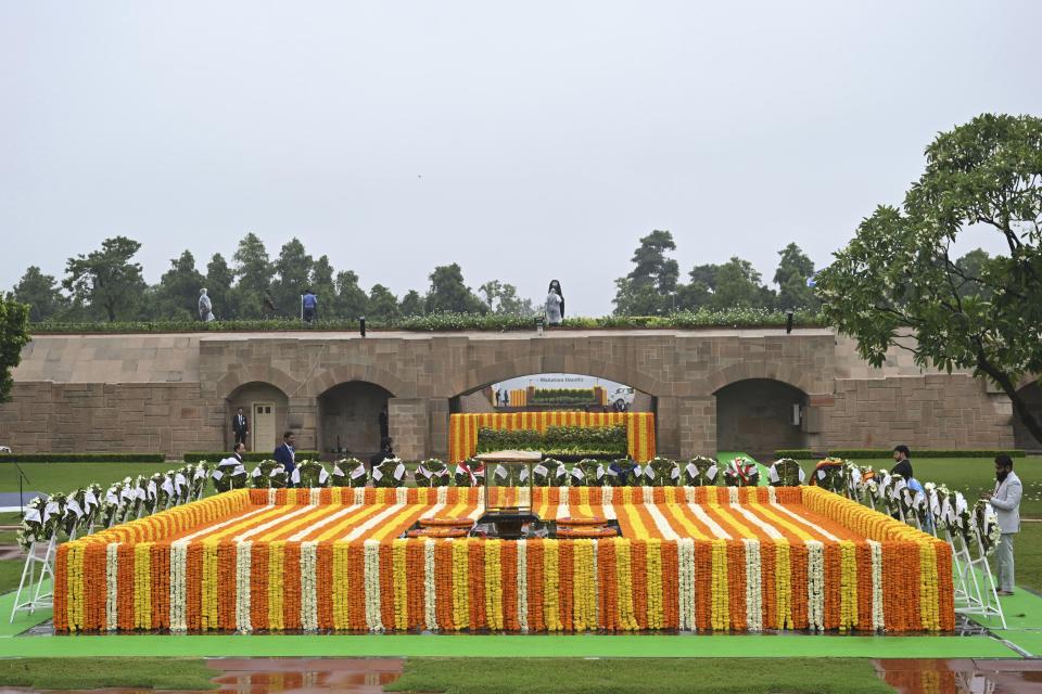 Gandhi memorial is seen covered with flowers as wreaths of G20 leaders are placed next to it before their arrival, in New Delhi, India, Sunday, Sept. 10, 2023. (AP Photo/Kenny Holston, Pool)