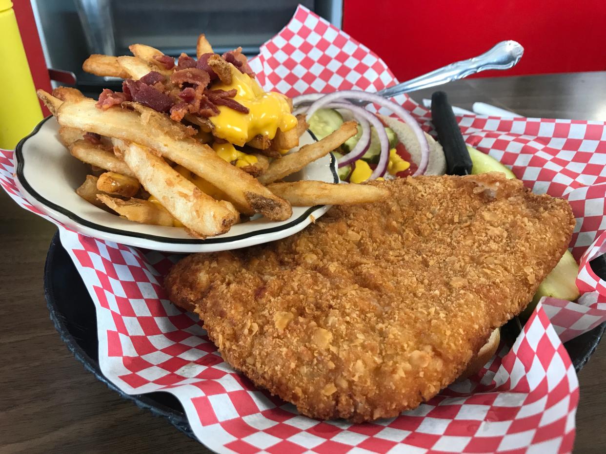 A breaded pork tenderloin sandwich with bacon cheese fries from Goldie's Ice Cream Shoppe in Prairie City.