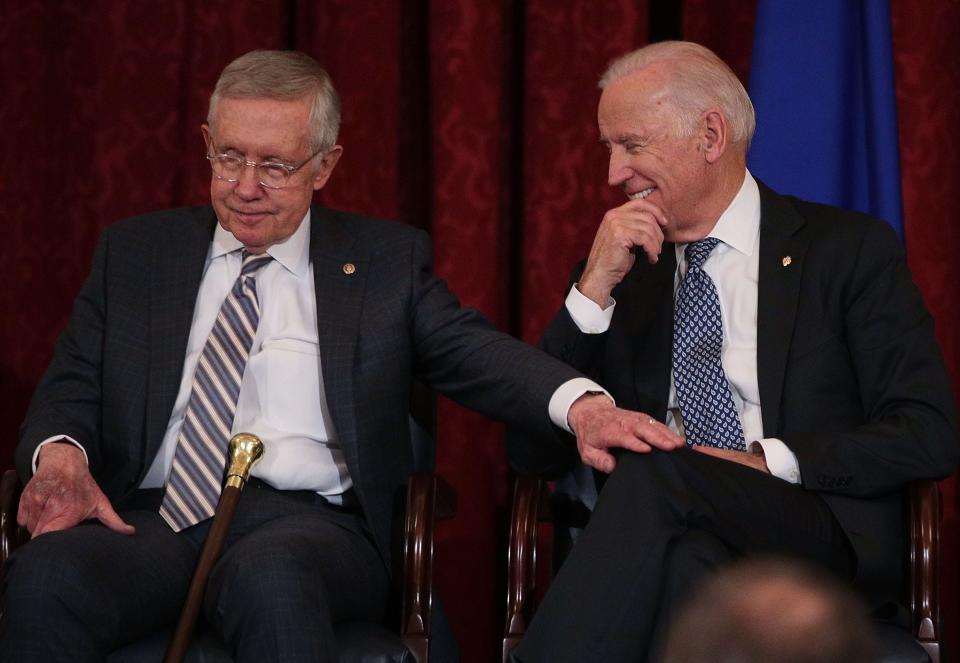 Senate Minority Leader Harry Reid shares a moment with Vice President Biden during Reid's leadership portrait unveiling ceremony on Dec. 8, 2016, on Capitol Hill.