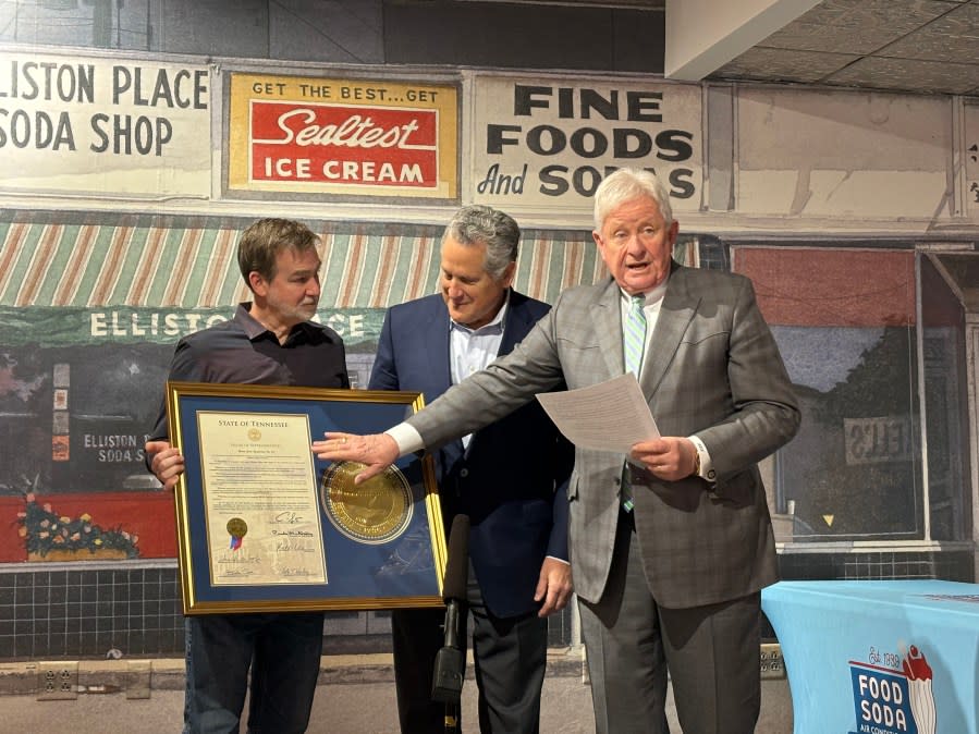 <em>Rep. Kelly Keisling, right, explains the proclamation celebrating Elliston Place Soda Shop with Manager Craig Clifft, left, and owner Tony Giarratana. (Source: Finn Partners)</em>