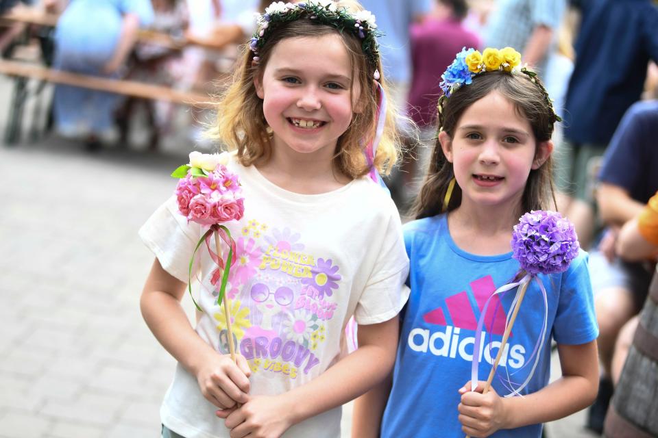 Cousins Adelyn and Clara with their Maifest flowers at Schulz BrÃ¤u Brewing Company's 2nd Annual Maifest on Saturday, May 13, 2023. 