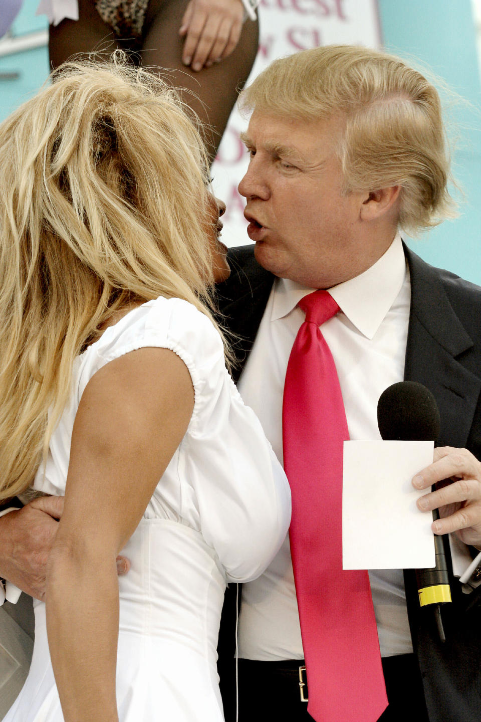 <p>Pamela Anderson and Donald Trump chat as they attend a special, “Donald J. Trump Birthday Quarter Million Dollar Giiveaway” celebration June 11, 2005, in Atlantic City. (Photo: Donald Kravitz/Getty Images) </p>