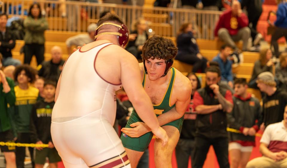 Montgomery’s Lucas Allen (green) beats Hillsborough’s Matt Jones (red) in the 215 weight class at the 2023 Somerset County Boys Wrestling Tournament on Jan. 7 at the gymnasium at Hillsborough High School in Hillsborough.