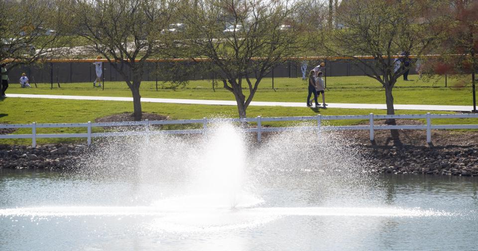 Walkers enjoy the path at Jackson's North Park. Voters will decide on a 1-mill replacement levy for the township parks department.