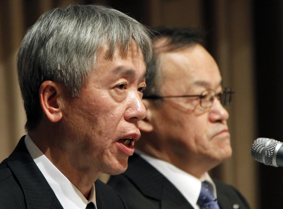 Nearly-named President of Olympus Corp. Hiroyuki Sasa, left, accompanied by his predecessor Shuichi Takayama, speaks during a press conference in Tokyo Monday, Feb. 27, 2012. The entire board of scandal-tainted Olympus is resigning, and the new president and a chairman were tapped Monday to lead a turnaround at the Japanese medical equipment maker. The changes will become final at the April 20 shareholders' meeting. (AP Photo/Koji Sasahara)