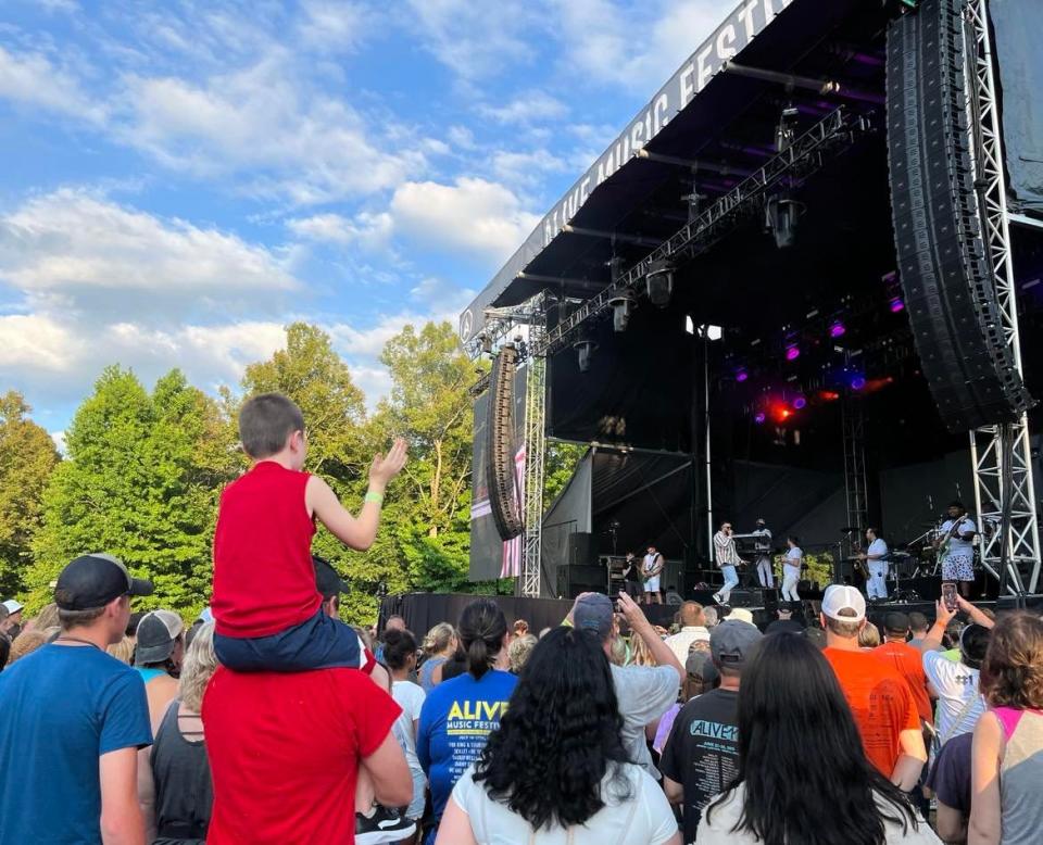 Fans watch Danny Gokey as he opens the Alive Music Festival on Thursday at Atwood Lake Park. TobyMac was the headliner, and concerts continue at the Christian music event through Sunday.