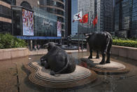 Bronze sculptures of bulls, the symbol of the Hong Kong Stock Exchange, are displayed at the Exchange Square in Central of Hong Kong, Tuesday, Oct. 8, 2019. The Hong Kong stock exchange on Tuesday formally dropped its bid to buy its London counterpart after the European exchange rejected the surprise offer. (AP Photo/Kin Cheung)