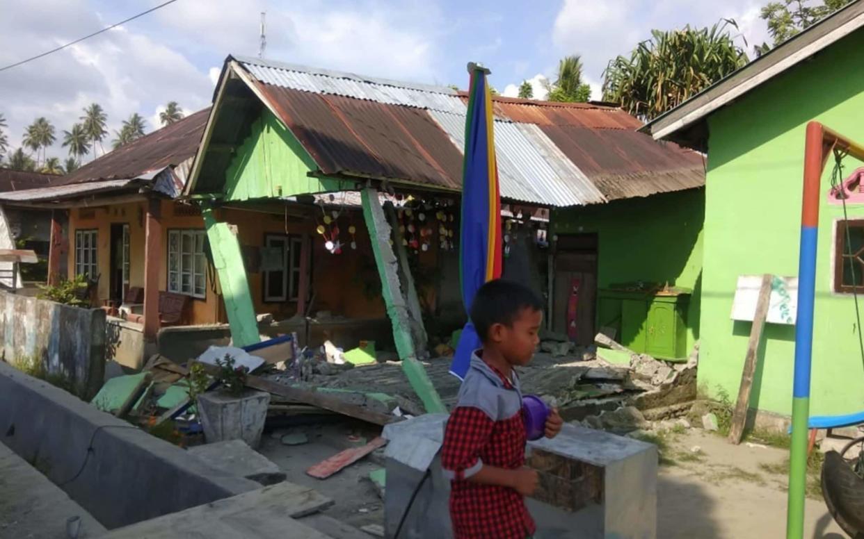 A collapsed house after the earthquake in Donggala, Central Sulawesi - AFP