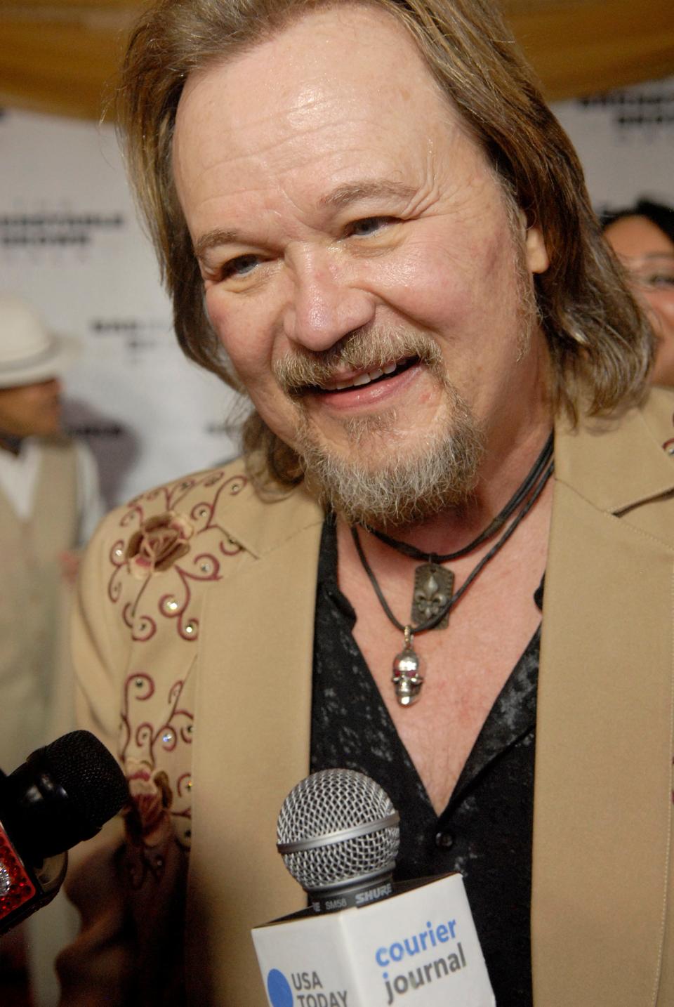 Country singer Travis Tritt talks to reporters on the red carpet at the 35th annual Barnstable Brown Gala on Friday night. May 03, 2024