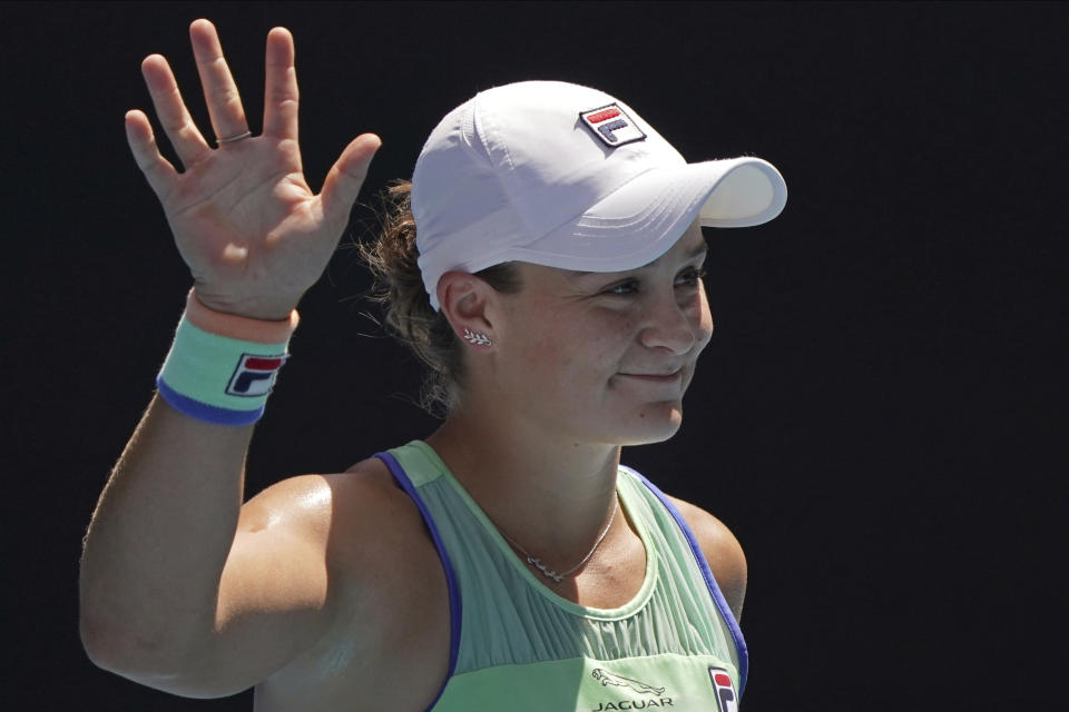 FILE - In this Jan. 28, 2020, file photo, Australia's Ash Barty waves after defeating Petra Kvitova of the Czech Republic in their quarterfinal match at the Australian Open tennis championship in Melbourne, Australia. Barty has joined the ranks of high-profile players expressing concern over the staging of the U.S. Open while there’s still so much uncertainty in the coronavirus pandemic. The women’s No. 1 hasn’t had the chance yet to defend her French Open title because all elite tennis competition is shuttered. She’s already processed the fact there’ll be no Wimbledon in 2020 but is still awaiting clarity on the U.S. Open, which is scheduled to begin Aug. 31, 2020. (AP Photo/Lee Jin-man, File)