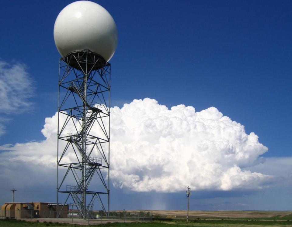A Doppler radar tower with a large white ball on top