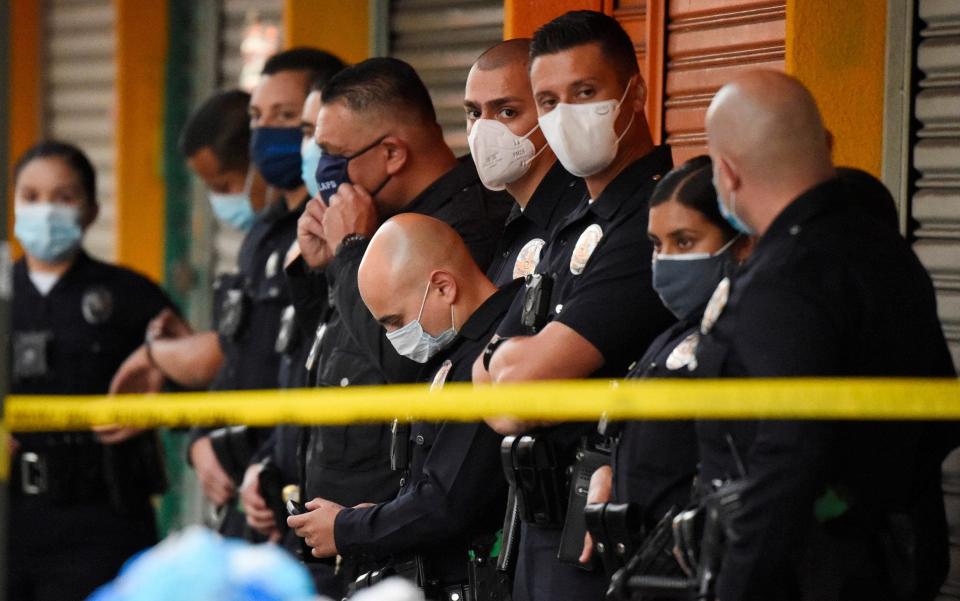 Los Angeles Police Department officers at the scene of a structure fire that injured multiple firefighters - AP Photo/Mark J. Terrill