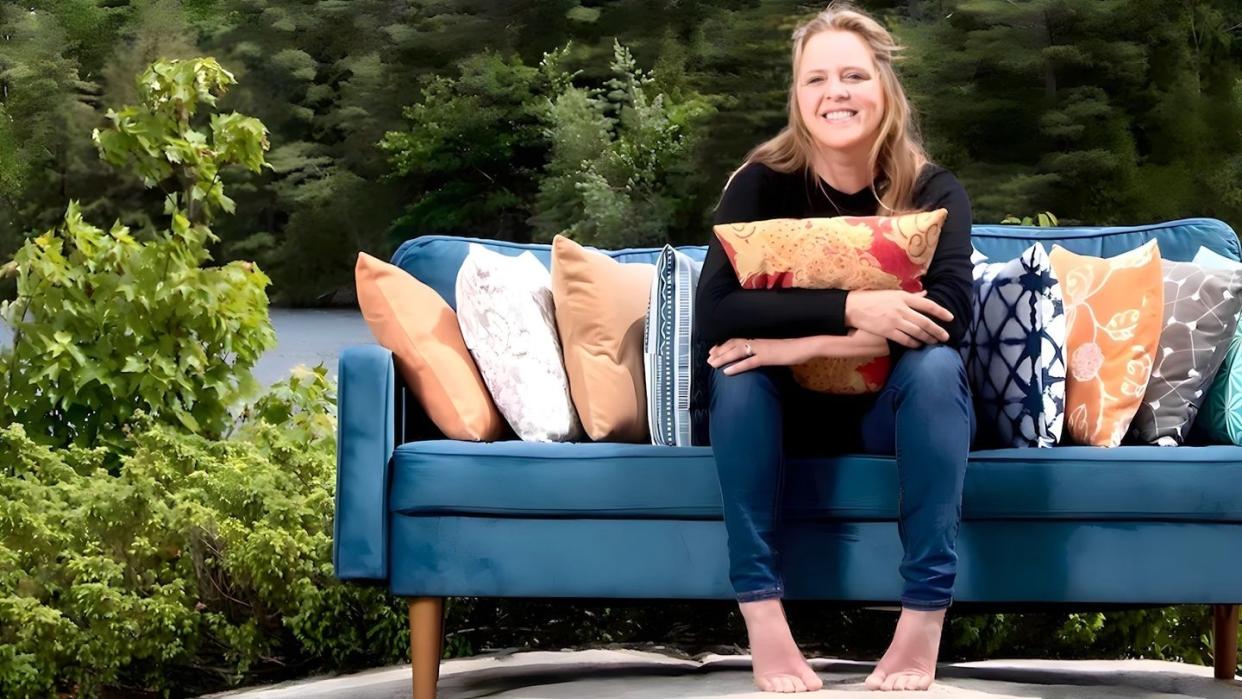 maine cabin masters star ashley morrill poses with her very own line of home decor products from newly launched brand rustic county