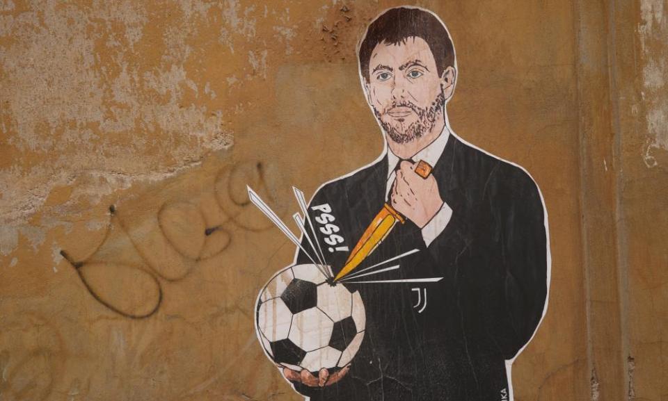 A mural showing Juventus president Andrea Agnelli making a hole in a football with a knife.