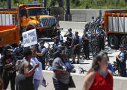 <p>Chicago Police officers monitor the scene as activists march onto Chicago Dan Ryan Expressway to protest violence in the city on July 7, 2018 in Chicago, Ill. (Photo: Kamil Krzaczynski/Getty Images) </p>