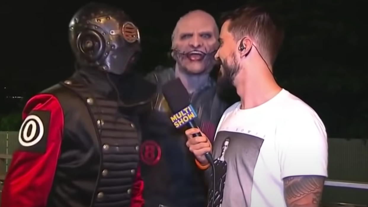  Sid Wilson and Corey Taylor with a reporter 