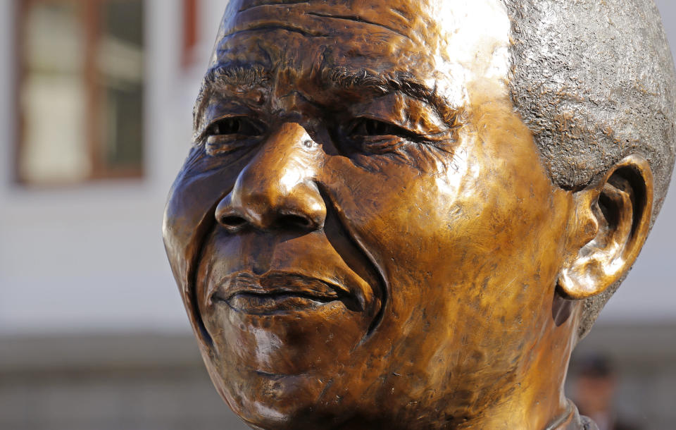 A bust of former South African President Nelson Mandela after it's unveiling by dignitaries at the South African Parliament in Cape Town, South Africa, Monday, April 28, 2014. South African President Jacob Zuma and members of the South African Parliament unveiled the bust of Mandela at Parliament, forming part of celebrations for 20-years anniversary of a democratic Parliament in South Africa after the end of white rule. (AP Photo/Schalk van Zuydam)