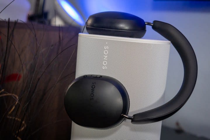 The Sonos Ace headphones sitting atop the Sonos Move 2 portable speaker.