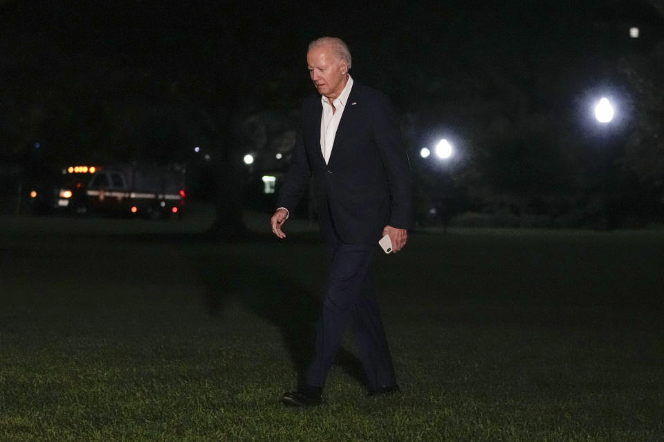 President Joe Biden walks across the South Lawn of the White House in Washington, Friday, Oct. 13, 2023, after returning from a trip to Philadelphia where he made an announcement during an economic-themed visit, and also a stop at his home in Delaware. (AP Photo/Susan Walsh)