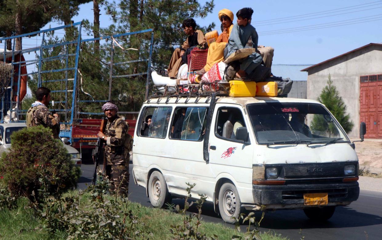 People flee Herat following intense fighting between Taliban militants and the Afghan special forces - Jalil Rezayee/Shutterstock