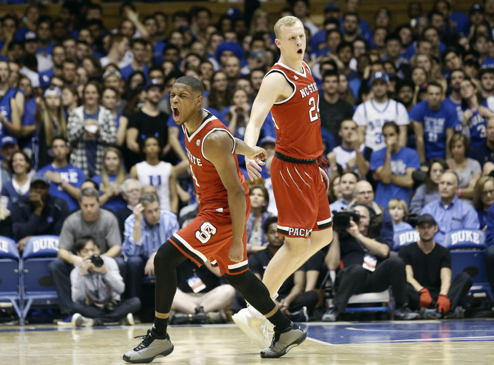 N.C. State's Dennis Smith Jr., left, and Maverick Rowan (24) react during the second half of an NCAA college basketball game against Duke in Durham, N.C., Monday, Jan. 23, 2017. North Carolina State won 84-82. (AP Photo/Gerry Broome)