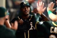 Aug 11, 2018; Anaheim, CA, USA; Oakland Athletics starting pitcher Edwin Jackson is congratulated in the dugout after being removed during the eighth inning against the Los Angeles Angels at Angel Stadium of Anaheim. Mandatory Credit: Orlando Ramirez-USA TODAY Sports